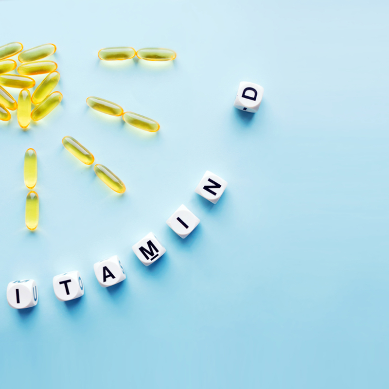 Vitamin D supplements arranged in the shape of the sun