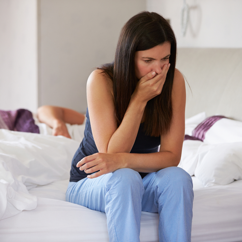 Pregnant woman feeling nauseous from morning sickness