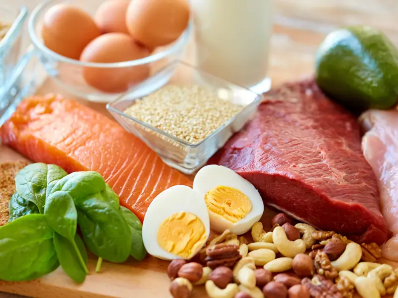 A range of protein-rich foods, including eggs, salmon and nuts loading=