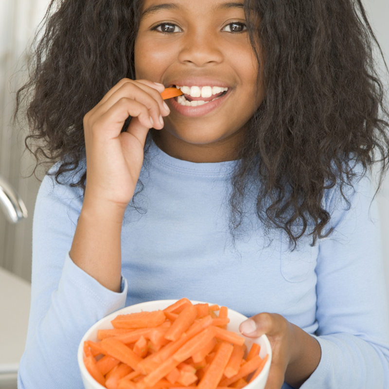 A child eating carrot sticks