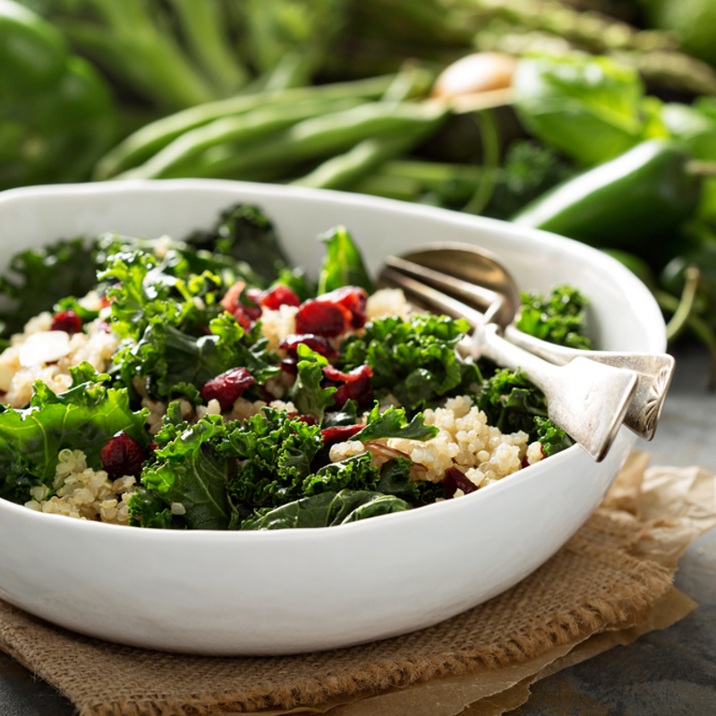 A salad with green vegetables and grains
