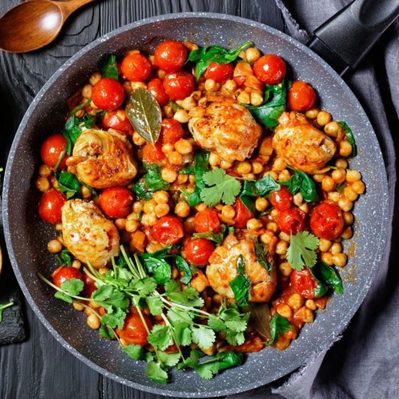 A dish of chicken tomatoes and chickpeas