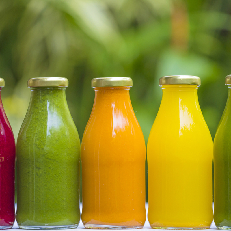 Bottles of colourful fruit juice