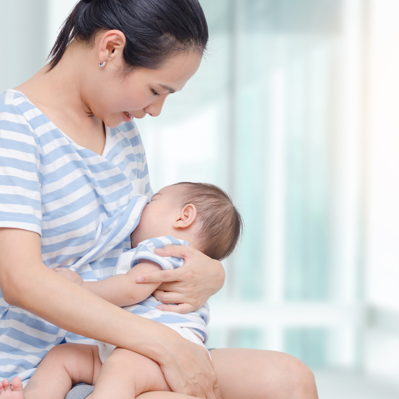 A mum breastfeeding her baby