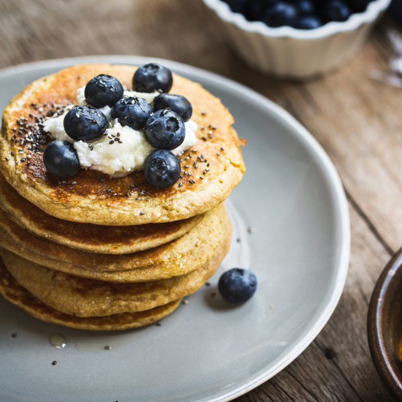 A stack of pancakes with blueberries