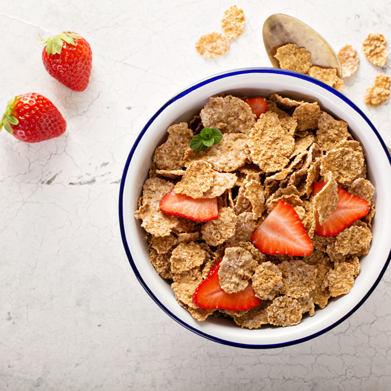 Bowl of wholegrain fortified cereal with strawberries