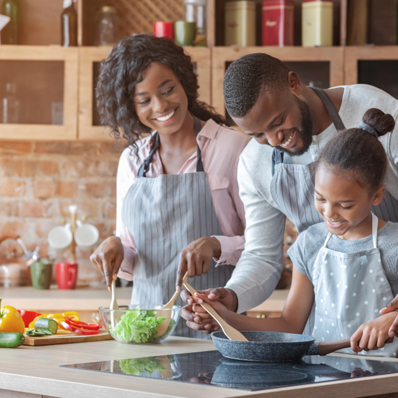 A family cooking together at home