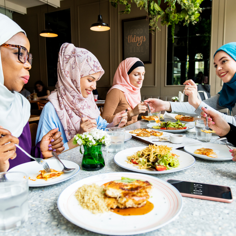 A group of women eating a meal together